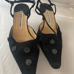 Low heeled black suede strap evening heels.